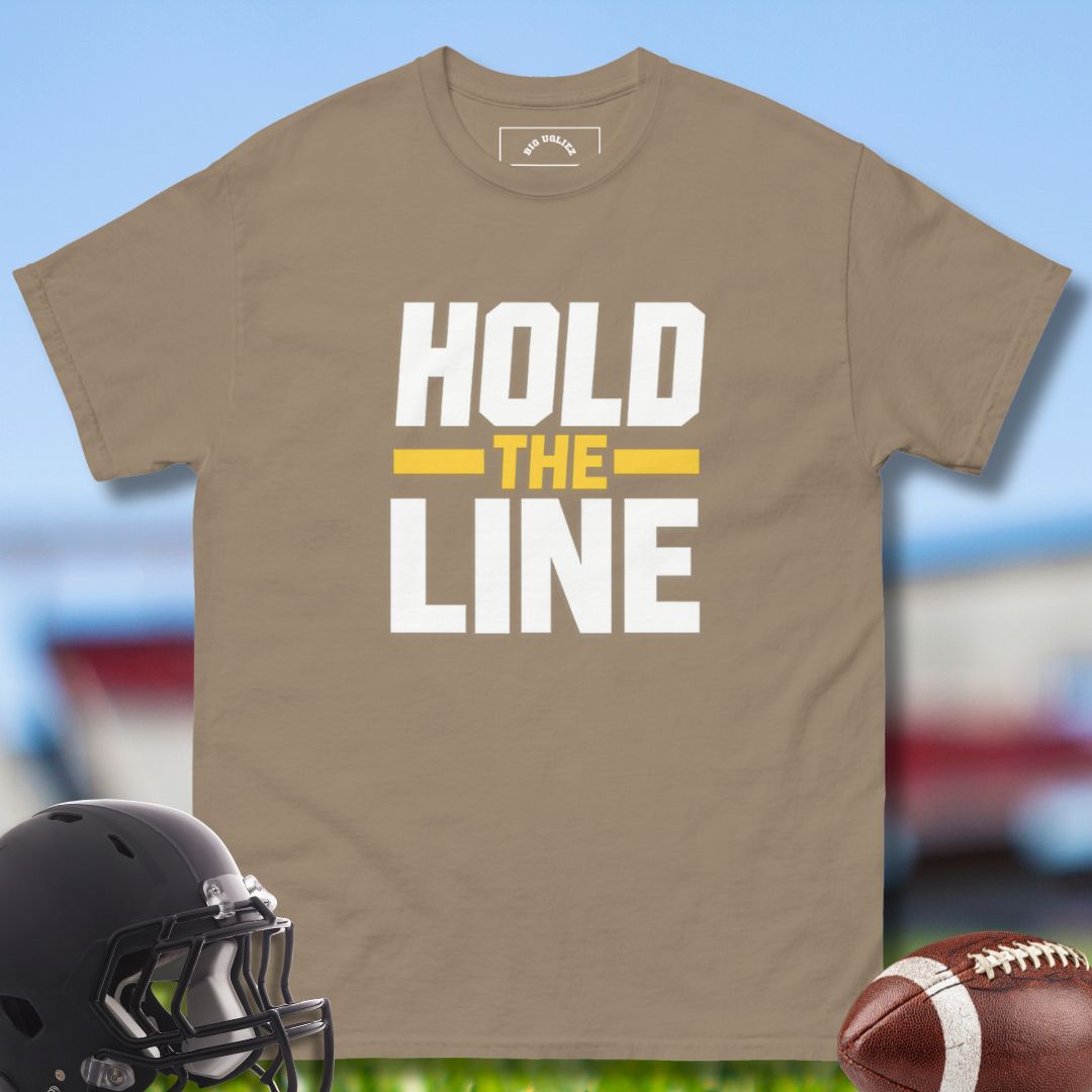 Brown t-shirt with 'Hold the Line' text, football helmet, and football on a sports field background