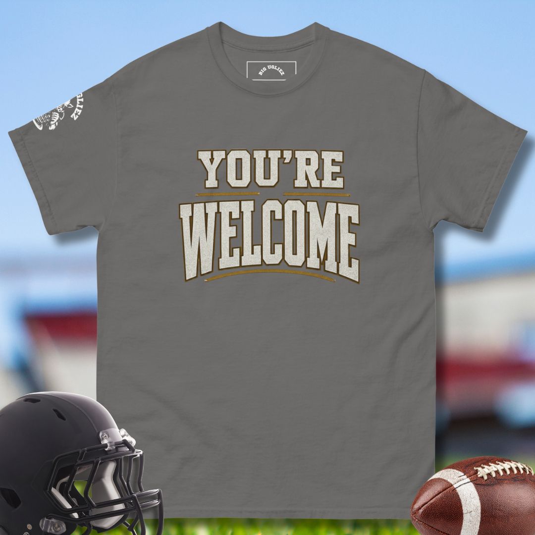 Gray t-shirt with 'YOU'RE WELCOME' text, football helmet, and football on a sports field background