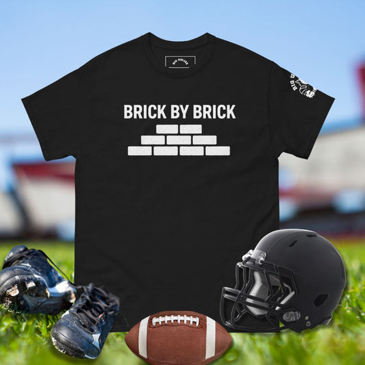 Football shirt with Brick by Brick text and stacked brick wall design