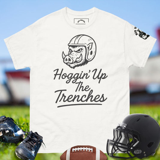 Big Ugliez Hoggin’ Up The Trenches t-shirt featuring fierce hog mascot in football helmet symbolizing offensive line strength.