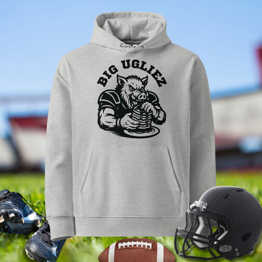 Gray hoodie with 'BIG UGLIEZ' graphic on a sports field background. Hoodie for the Olinemen.