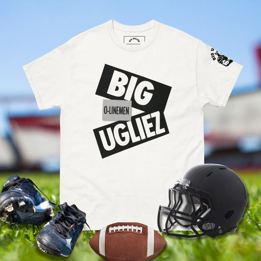 White t-shirt with 'BIG UGLIEZ' text, football helmet, cleats, and football on a sports field background.