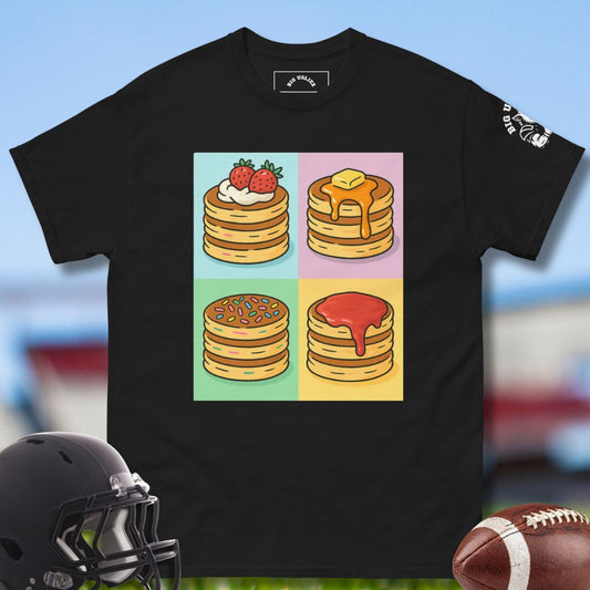 Black t-shirt with colorful stack graphic on a blurred football sports-themed background
