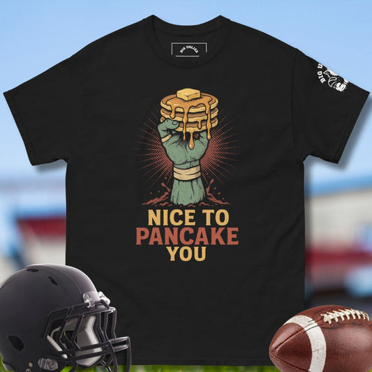 black tshirt with design of hand holding pancake with the text Nice to pancake you by Big Ugliez