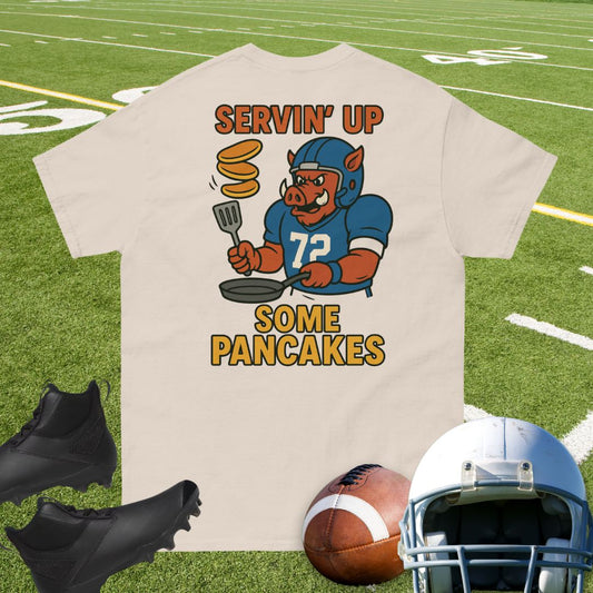Big Ugliez hog in football jersey number 72 flipping pancakes with a spatula